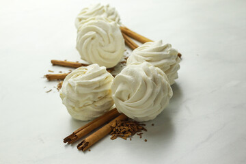 Tasty zephyr with cinnamon on light background