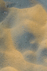 closeup of sand pattern of a beach in the summer