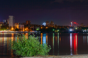 Fototapeta na wymiar Panorama of night city with embankment of Rostov-on-Don