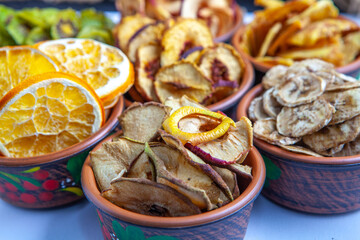 Organic Healthy Assorted Dried Fruit Mix close up. Dried fruit snacks. dried apples, mango, feijoa, dried apricots, prunes top view