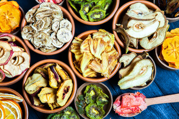 Organic Healthy Assorted Dried Fruit Mix close up. Dried fruit snacks. dried apples, mango, feijoa, dried apricots, prunes top view