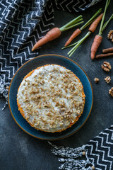 Delicious carrot cake with ingredients on abstract geometric minimalist background