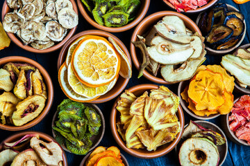 Organic Healthy Assorted Dried Fruit Mix close up. Dried fruit snacks. dried apples, mango, feijoa, dried apricots, prunes top view