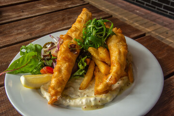 Australian style beer battered fish and chips with salad and proper tartar sauce