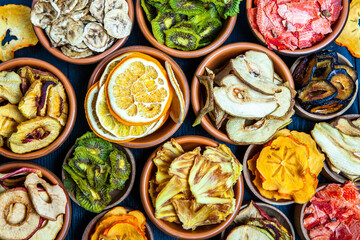 Organic Healthy Assorted Dried Fruit Mix close up. Dried fruit snacks. dried apples, mango, feijoa, dried apricots, prunes top view