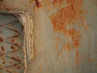 Rust.Old blue painted wall with rust spots.Textured rusty metal background. Rust stains through the cracked blue paint.