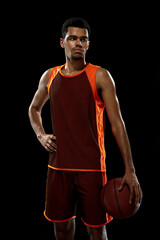 Posing. Young purposeful african-amrican basketball player training, practicing in action, motion...