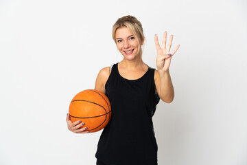 Young Russian woman playing basketball isolated on white background happy and counting four with fingers
