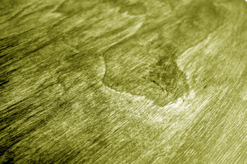 Wooden board texture with blur effect in yellow tone.