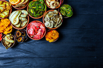 Organic Healthy Assorted Dried Fruit Mix close up. Dried fruit snacks. dried apples, mango, feijoa, dried apricots, prunes top view