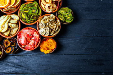 Organic Healthy Assorted Dried Fruit Mix close up. Dried fruit snacks. dried apples, mango, feijoa, dried apricots, prunes top view