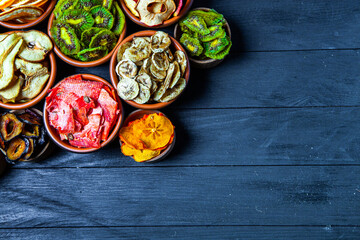 Organic Healthy Assorted Dried Fruit Mix close up. Dried fruit snacks. dried apples, mango, feijoa, dried apricots, prunes top view