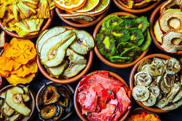 Organic Healthy Assorted Dried Fruit Mix close up. Dried fruit snacks. dried apples, mango, feijoa, dried apricots, prunes top view