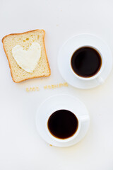 sandwich for breakfast in form of heart with cheese - good morning sign and two coffee cups