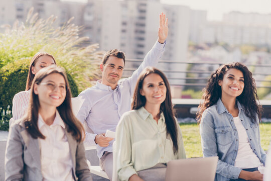 Portrait of attractive cheerful smart entrepreneurs attending conference asking questions to speaker on fresh air outside outdoor