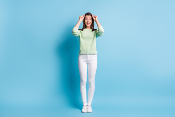 Full length photo of impressed girl raise her eyeglasses scream isolated over blue pastel color background