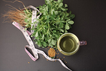 Close up of Fenugreek with its seeds and powder and the extracted water. It helps in numerous...