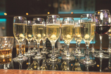 Close up of glasses of champagne on the table with shallow depth of field