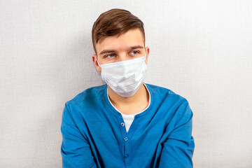 Sad Young Man in Flu Mask