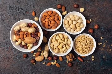 White bowls with nut mix as snack or ingredient for tasty and healthy dessert, meal