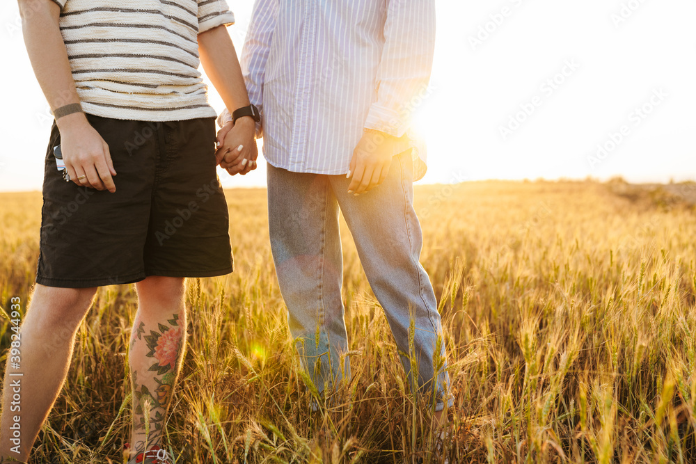 Wall mural loving couple walking together outside