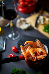Obraz na płótnie Canvas black shrimp table with wine noodles and spices