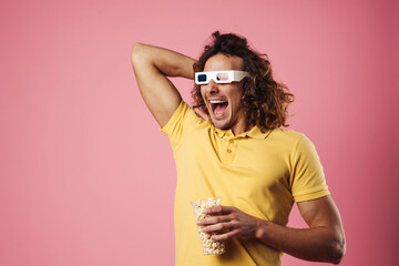 Cheerful young man wearing 3d glasses
