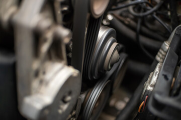 Fototapeta na wymiar AC generator for a car close-up, the engine compartment of a passenger car.