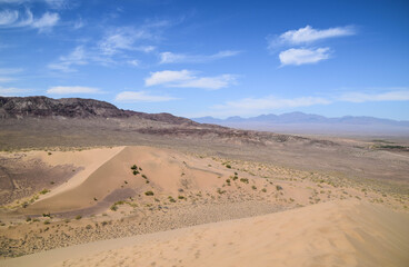 Fototapeta na wymiar Widest view from above. Singing dune (Sand dune) in the Altyn Emel Nationalpark, Kazakhstan