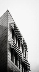 office building with silver vented facade 