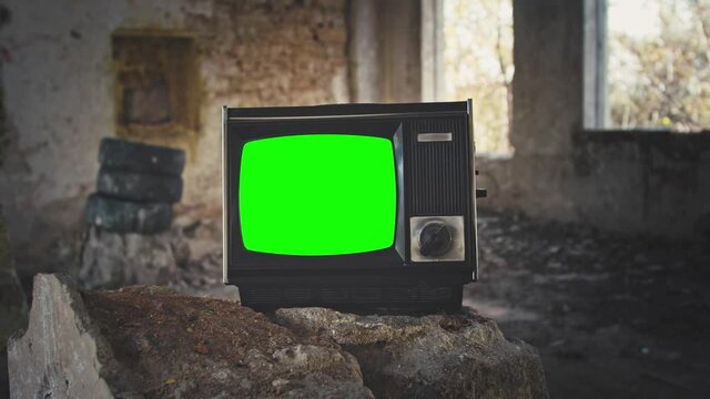 vintage television set with green screen