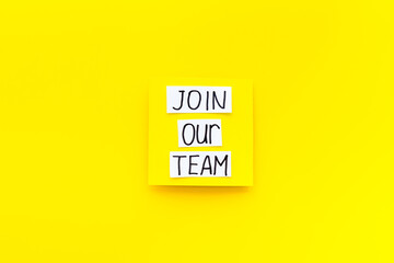 Join our team - recruting concept. Words Join our team on paper banner, top view