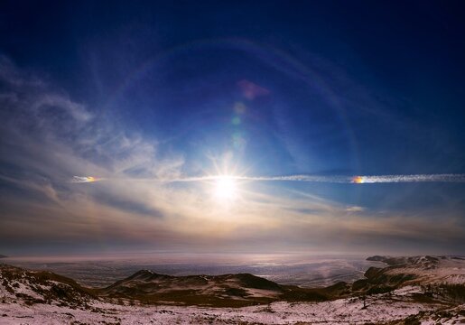 Beautiful fantastic sun halo phenomenon in sky, Miraculous sun with circular rainbow.