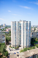 Obraz premium Russia, Volgograd, 07.13.2020: High multi-storey modern residential building. View from a height of the residential complex