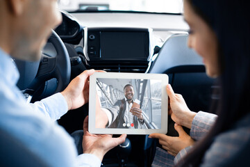 Business People Making Video Call Having Online Meeting In Car