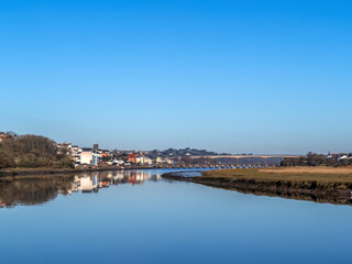Fototapeta premium Winter sunshine view of Bideford and River Torridge estuary, high tide, north Devon, England.