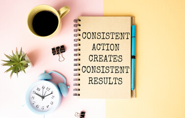 Consisten Action Creates Consistent Results text on the Book isolated on office desk background