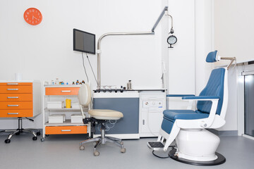 Modern dental practice. Dental chair and other accessories used by dentists. Dentist Office, Dental Hygiene. Colorful interior of dentistry office with chair and tools.