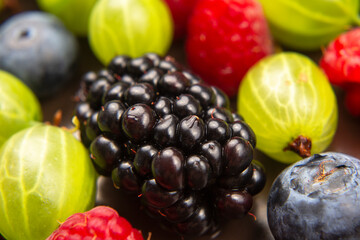 lots of fresh different berries. useful vitamin healthy food fruit. healthy vegetable breakfast