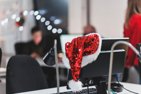 Santa hat on computer monitor - Powered by Adobe