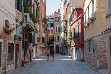 Fototapeta na wymiar Panoramic view of Venice narrow street with historical buildings