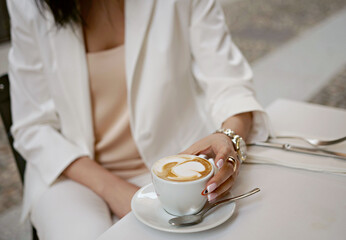 Coffee in a Cup. Hand with a Cup of coffee