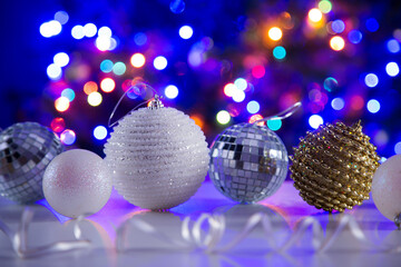 Fototapeta na wymiar Christmas balls against the backdrop of a Christmas tree