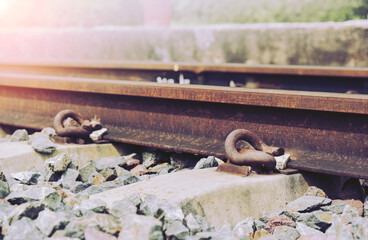 Close up Rail fastener for hole rail with concrete plinth track of sky train on retro filter tone.