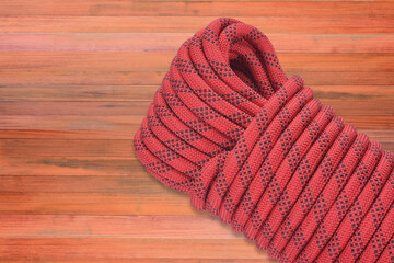 Close up Abseil rope background showing hiking safety equipment extreme sports shops on wooden background.