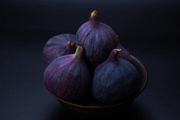 Tasty figs on a black background. Top view.
