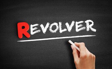 Fototapeta premium Revolver text on blackboard, concept background