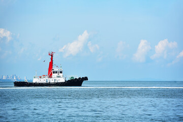 Obraz premium Tug Boat Ready To Help Ships in the blue sea