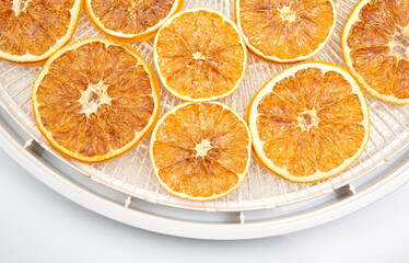 mix of different pieces of dried citrus fruit on white background
