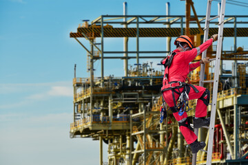 Workers wearing equipment full safety harness in construction site